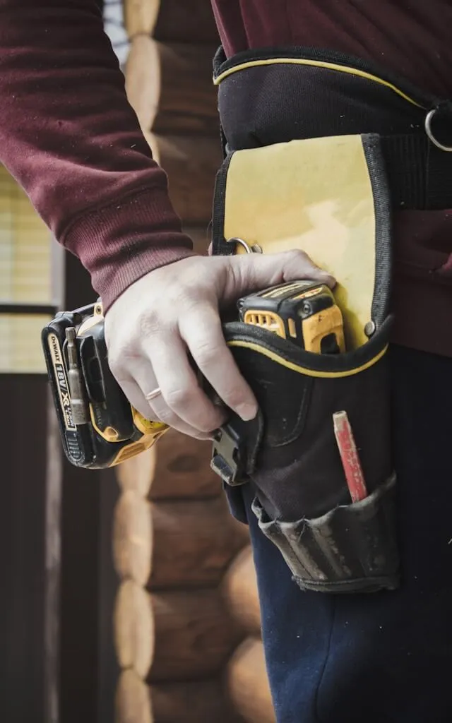 A carpenter with a tool belt